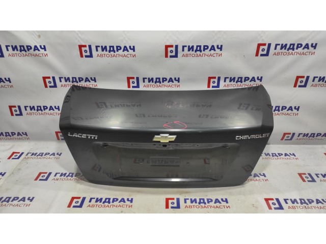 Крышка багажника Chevrolet Lacetti 96474985. Вмятина.