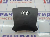 Подушка безопасности в рулевое колесо Hyundai Grand Starex (TQ) 569004H100WK.