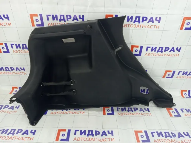Обшивка багажника левая Kia Rio 857304Y500WK