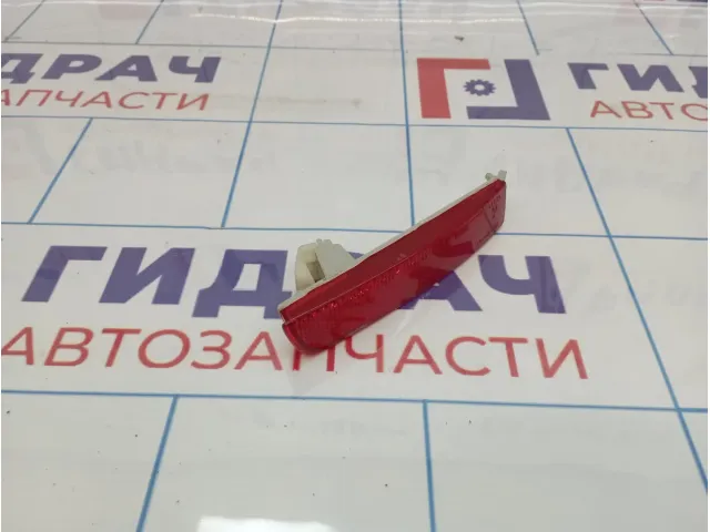 Отражатель в бампер задний левый Nissan Juke (YF15)