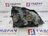 Фара левая Renault Symbol 7701057654