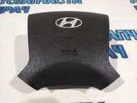 Подушка безопасности в рулевое колесо Hyundai H1/Grand Starex 569004H000WK .