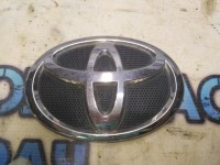 Эмблема в решетку радиатора Toyota Corolla 150 7530112390 Отличное состояние.