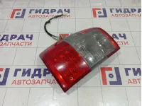 Фонарь задний наружный левый Toyota Land Cruiser 8156060480