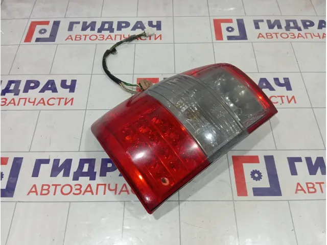 Фонарь задний наружный левый Toyota Land Cruiser 8156060480